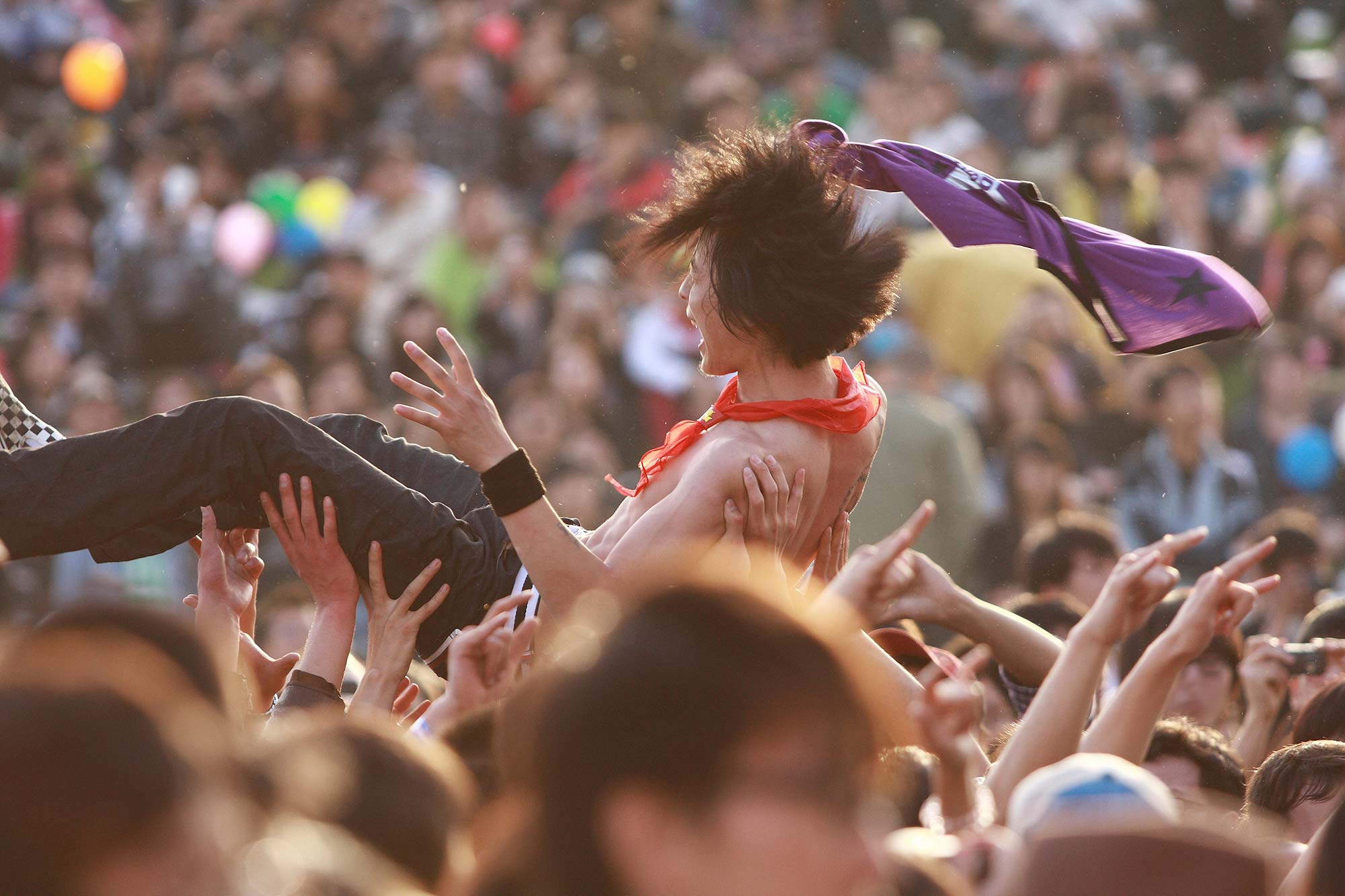 Crowd surfing at a concert